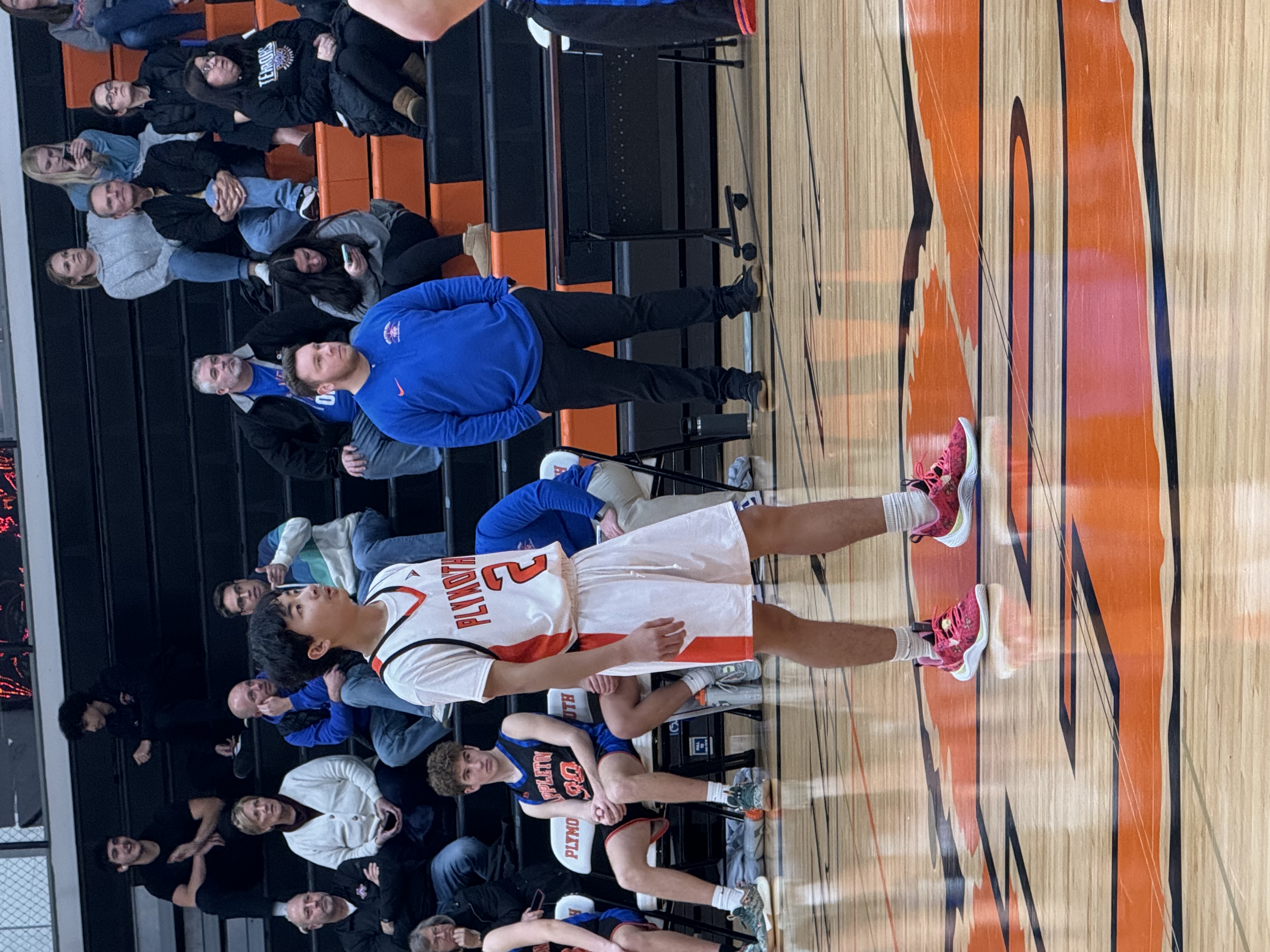 Picture of Pitu playing in high school basketball